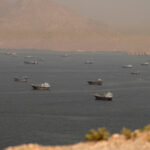 Strait of Hormuz Escort Operations Paused After Commercial Ship Hit in Suspected Attack Near Oman