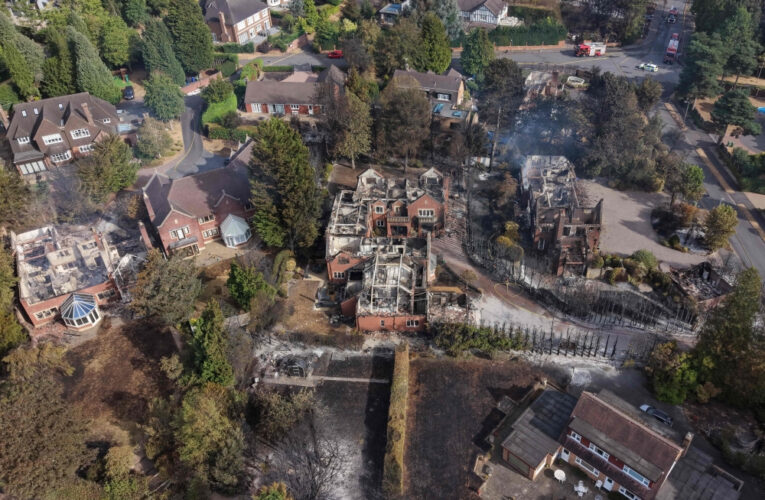 UK firefighters battle raging wildfires as heatwave scorches homes and puts thousands at risk