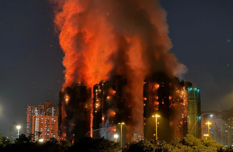 Hong Kong leader apologises for deadly blaze that killed 168 as housing minister resigns