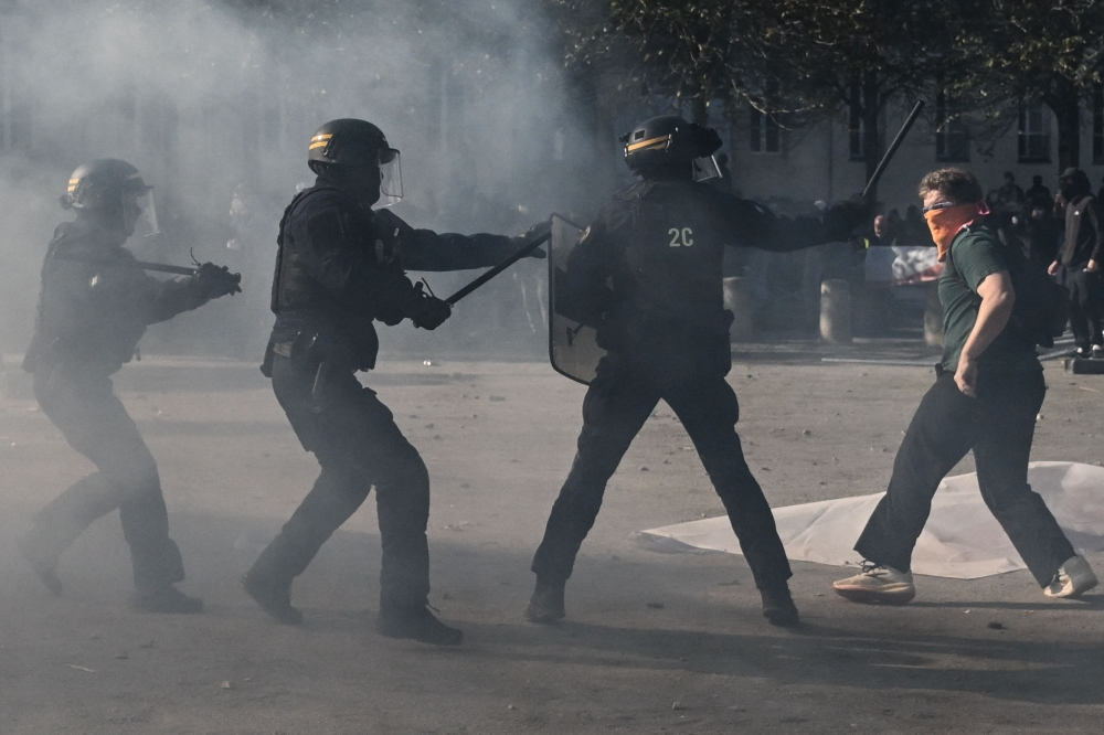 Paris police arrest record 855 people after violent protests and widespread looting